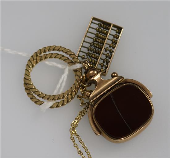 A 9ct gold and bloodstone swivel fob seal, a 14ct gold abacus pendant and chain, and two yellow metal rope pattern rings.